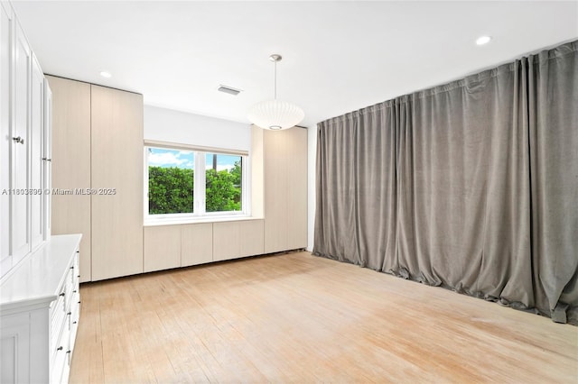 5120 Cherokee Ave, Miami Beach, FL 33140 - empty room with light wood-type flooring and recessed lighting