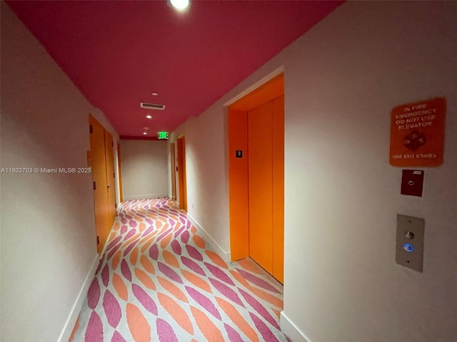 31 SE 6th St Unit 907, Miami, FL 33131 - corridor featuring baseboards, recessed lighting, light carpet, and elevator