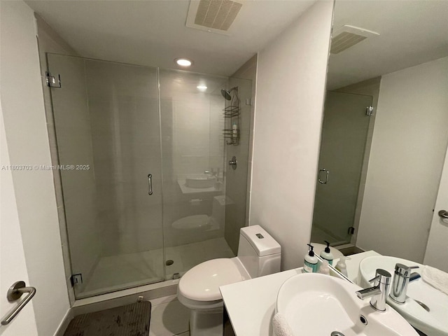 31 SE 6th St Unit 907, Miami, FL 33131 - full bathroom featuring toilet, a stall shower, and vanity