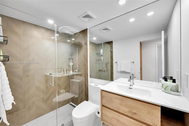 10185 Collins Ave Unit 1502, Bal Harbour, FL 33154 - bathroom featuring toilet, vanity, a shower stall, and recessed lighting