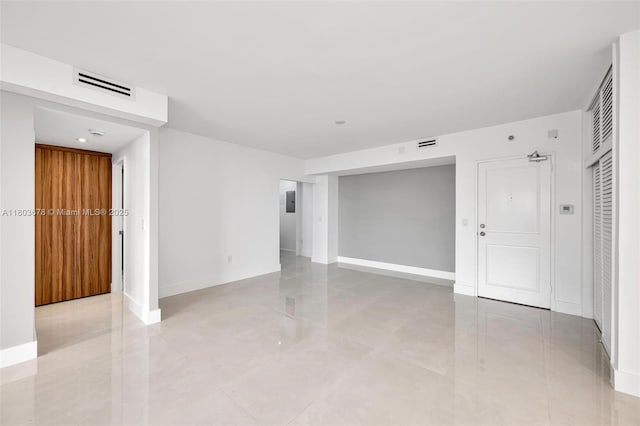 10185 Collins Ave Unit 1502, Bal Harbour, FL 33154 - empty room featuring baseboards and light tile patterned floors