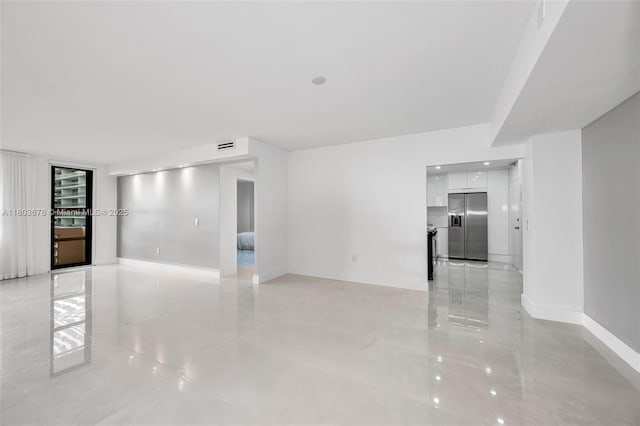 10185 Collins Ave Unit 1502, Bal Harbour, FL 33154 - spare room with light tile patterned floors and baseboards