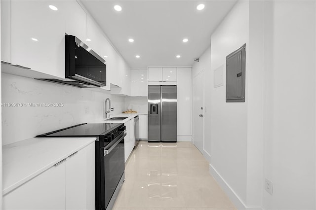 10185 Collins Ave Unit 1502, Bal Harbour, FL 33154 - kitchen with stainless steel appliances, electric panel, modern cabinets, a sink, and white cabinets