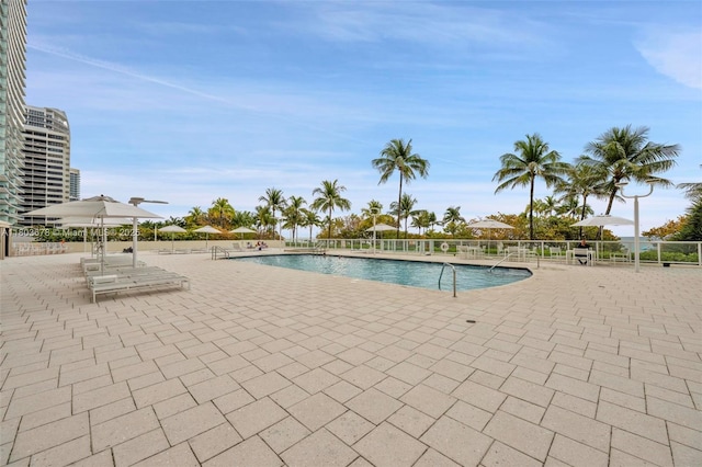 10185 Collins Ave Unit 1502, Bal Harbour, FL 33154 - community pool featuring a patio and fence