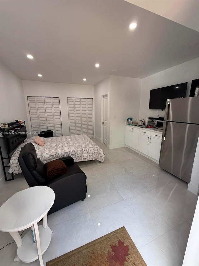 9740 SW 155th Ave, Miami, FL 33196 - bedroom featuring freestanding refrigerator, recessed lighting, and multiple closets