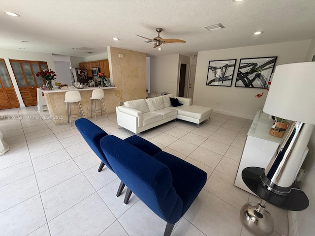 9740 SW 155th Ave, Miami, FL 33196 - living area with recessed lighting, a textured ceiling, light tile patterned flooring, ceiling fan, and baseboards