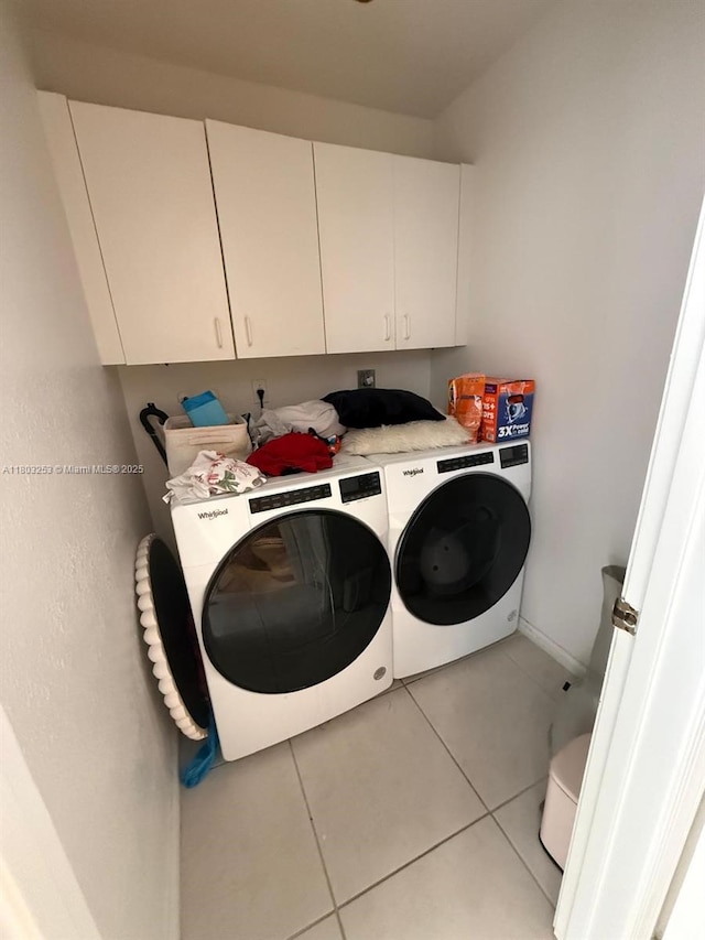 9740 SW 155th Ave, Miami, FL 33196 - laundry room with cabinet space, independent washer and dryer, light tile patterned floors, and baseboards
