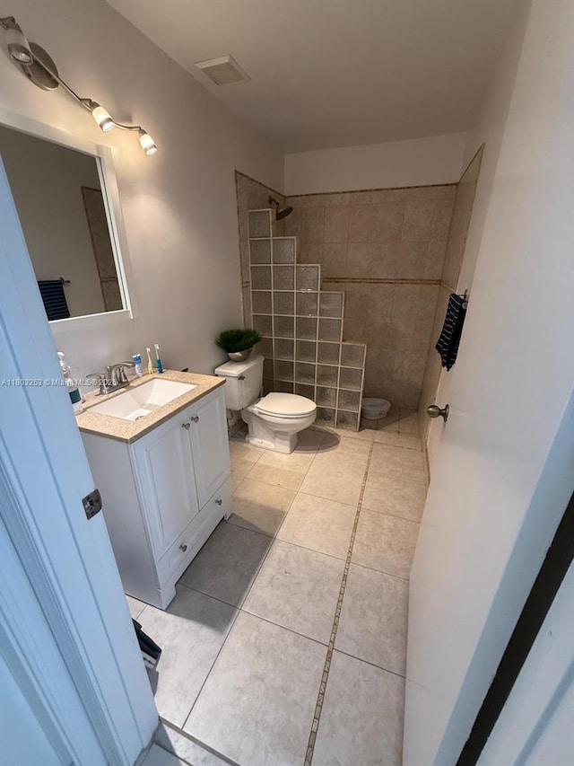 9740 SW 155th Ave, Miami, FL 33196 - full bathroom featuring toilet, tiled shower, vanity, and tile patterned flooring