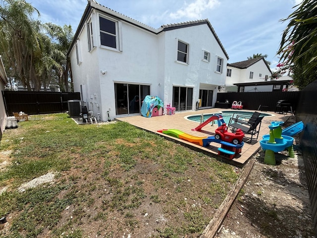9740 SW 155th Ave, Miami, FL 33196 - rear view of property with stucco siding and central AC unit