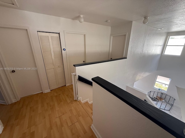9740 SW 155th Ave, Miami, FL 33196 - hall featuring an upstairs landing, light wood finished floors, and baseboards