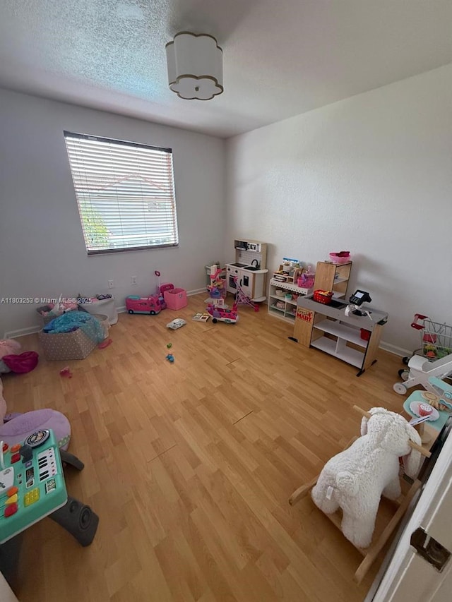 9740 SW 155th Ave, Miami, FL 33196 - playroom featuring wood finished floors and baseboards