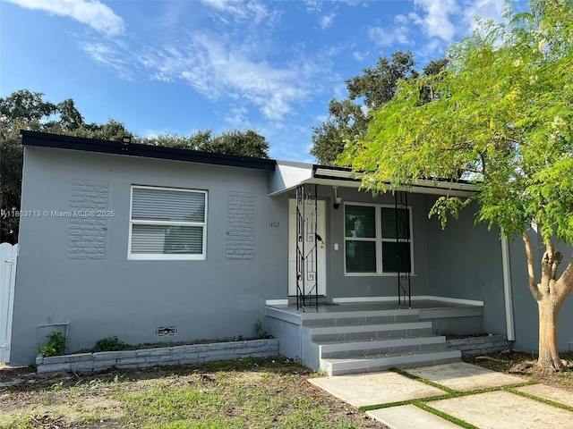 1472 NE 150th St, Miami, FL 33161 - view of front of property with a porch and stucco siding