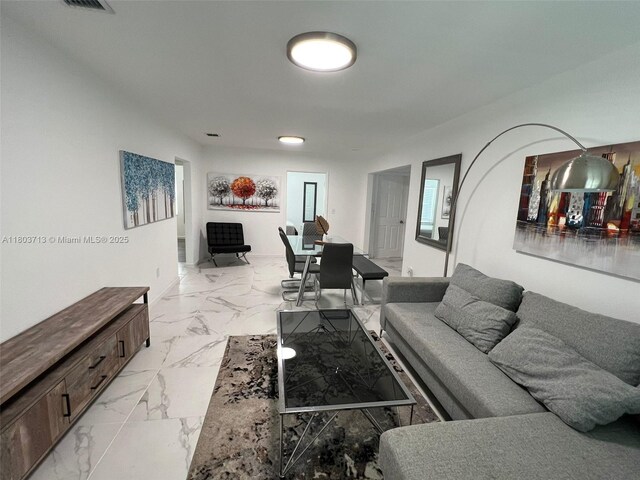 1472 NE 150th St, Miami, FL 33161 - living room featuring light marble finish floors