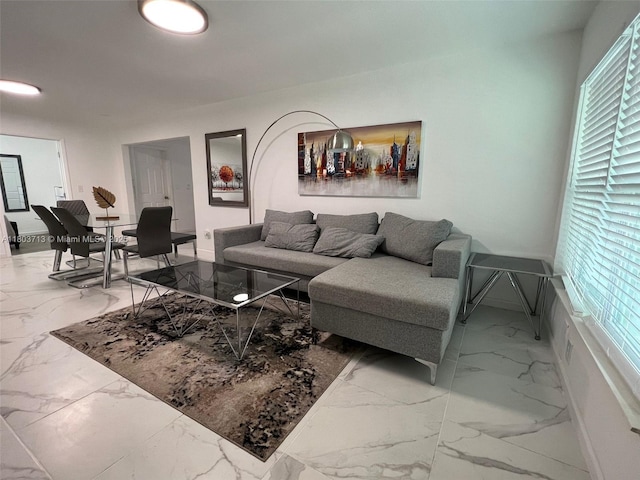 1472 NE 150th St, Miami, FL 33161 - living room featuring marble look tile flooring and baseboards