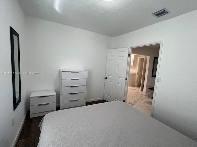1472 NE 150th St, Miami, FL 33161 - bedroom featuring baseboards and dark marble finish flooring