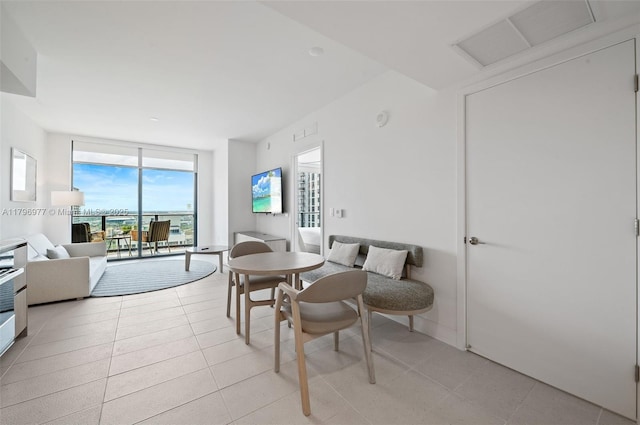 601 NE 1st Ave Unit 3504, Miami, FL 33132 - dining space featuring light tile patterned floors and a wall of windows