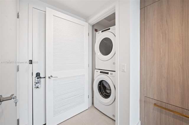 601 NE 1st Ave Unit 3504, Miami, FL 33132 - washroom featuring stacked washer / dryer and light tile patterned floors