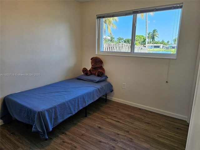 8240 NW 15th St, Pembroke Pines, FL 33024 - bedroom featuring wood finished floors and baseboards