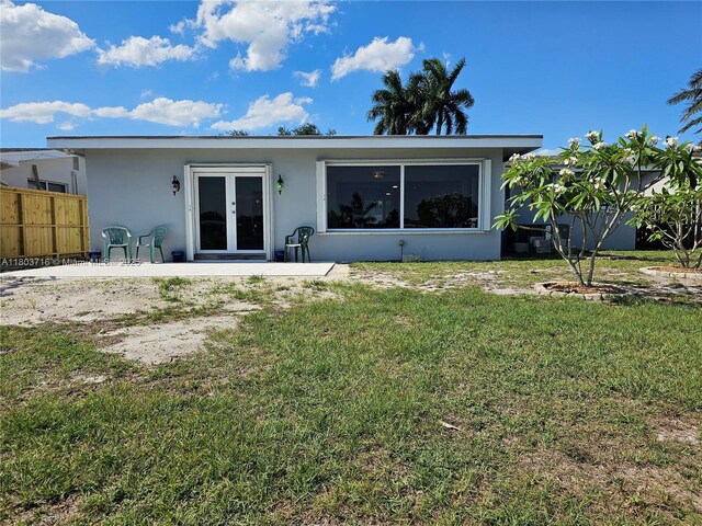 8240 NW 15th St, Pembroke Pines, FL 33024 - rear view of property featuring stucco siding, french doors, and a patio area