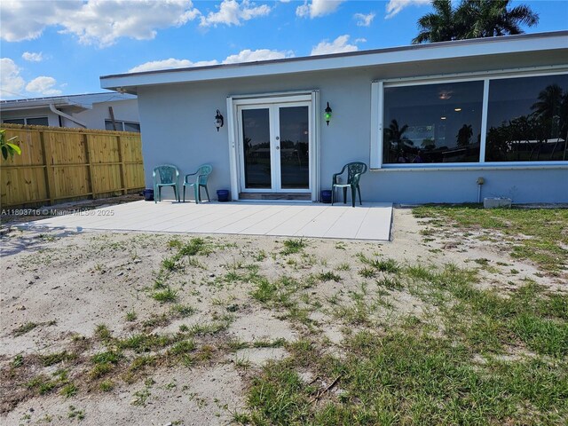 8240 NW 15th St, Pembroke Pines, FL 33024 - back of house with fence, stucco siding, and a deck