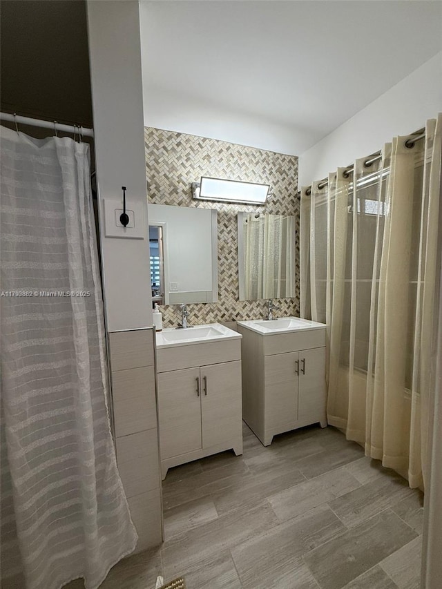513 Racquet Club Rd Unit 56, Weston, FL 33326 - bathroom featuring tile walls, two vanities, and a shower with curtain