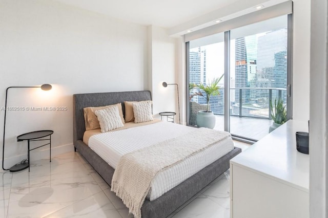 1300 S Miami Ave Unit 2006, Miami, FL 33130 - bedroom featuring light marble finish floors, access to exterior, and baseboards
