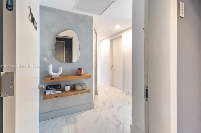 1300 S Miami Ave Unit 2006, Miami, FL 33130 - hallway with marble look tile flooring, recessed lighting, and baseboards