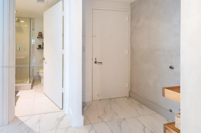 1300 S Miami Ave Unit 2006, Miami, FL 33130 - full bathroom featuring a shower stall, toilet, and marble look tile flooring