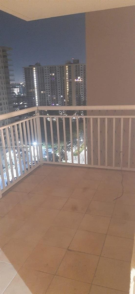 251 174th St Unit 1711, Sunny Isles Beach, FL 33160 - balcony at twilight featuring a view of city lights