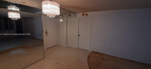 251 174th St Unit 1711, Sunny Isles Beach, FL 33160 - unfurnished room featuring a chandelier