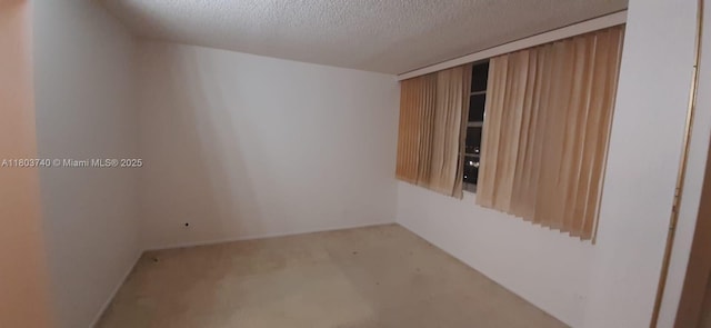 251 174th St Unit 1711, Sunny Isles Beach, FL 33160 - carpeted spare room with a textured ceiling