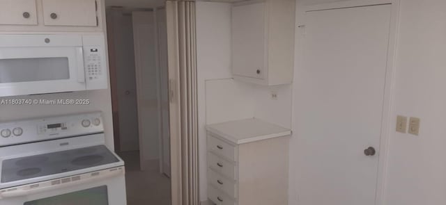 251 174th St Unit 1711, Sunny Isles Beach, FL 33160 - kitchen featuring white appliances, light countertops, and white cabinets