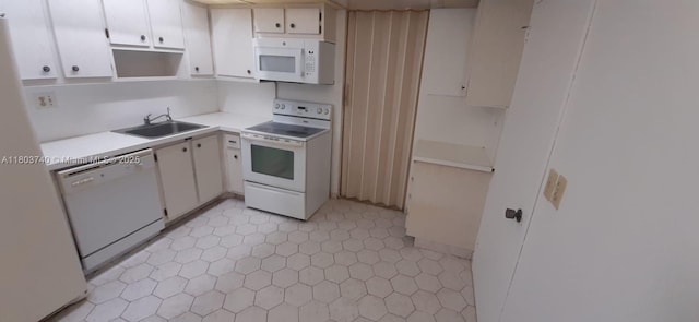 251 174th St Unit 1711, Sunny Isles Beach, FL 33160 - kitchen featuring white appliances, a sink, light countertops, white cabinets, and open shelves