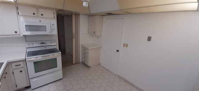 251 174th St Unit 1711, Sunny Isles Beach, FL 33160 - kitchen with white appliances, light countertops, and white cabinets