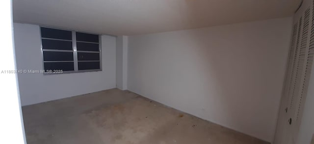 251 174th St Unit 1711, Sunny Isles Beach, FL 33160 - spare room featuring unfinished concrete flooring