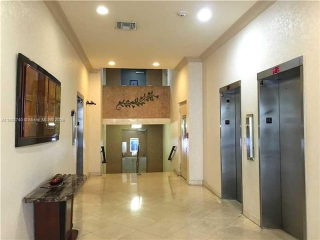 251 174th St Unit 1711, Sunny Isles Beach, FL 33160 - hallway featuring elevator, crown molding, light tile patterned floors, and recessed lighting
