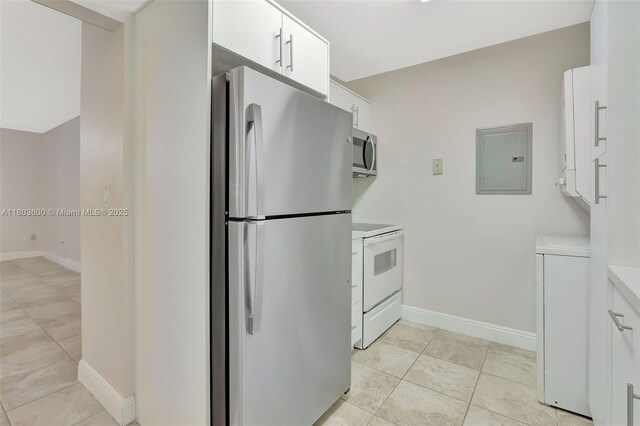 7915 SW 86th St Unit 705, Miami, FL 33143 - kitchen with stainless steel appliances, electric panel, light countertops, white cabinets, and baseboards