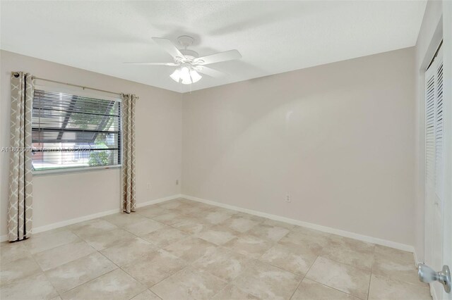 7915 SW 86th St Unit 705, Miami, FL 33143 - unfurnished room featuring ceiling fan, baseboards, and light tile patterned floors