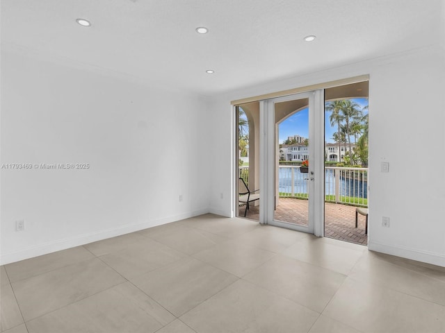 3144 NE 212th St, Aventura, FL 33180 - tiled spare room with french doors, a water view, recessed lighting, and baseboards