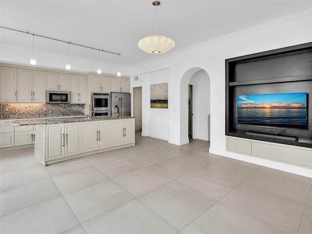 3144 NE 212th St, Aventura, FL 33180 - kitchen featuring stainless steel appliances, light stone countertops, arched walkways, decorative backsplash, and crown molding