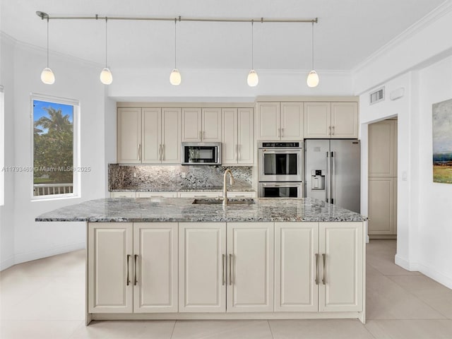 3144 NE 212th St, Aventura, FL 33180 - kitchen featuring appliances with stainless steel finishes, light tile patterned flooring, stone counters, ornamental molding, and backsplash