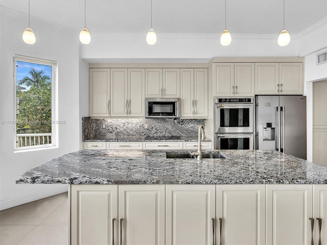 3144 NE 212th St, Aventura, FL 33180 - kitchen featuring appliances with stainless steel finishes, backsplash, dark stone countertops, ornamental molding, and decorative light fixtures