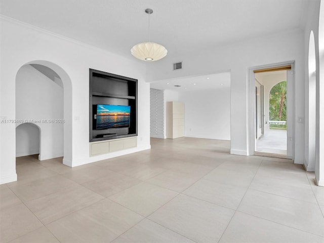 3144 NE 212th St, Aventura, FL 33180 - unfurnished living room featuring built in shelves, light tile patterned floors, a fireplace, and crown molding