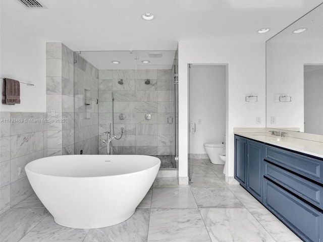 3144 NE 212th St, Aventura, FL 33180 - bathroom with vanity, a shower stall, marble finish floors, a freestanding tub, and toilet