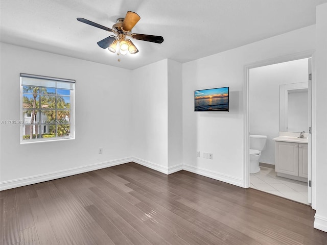 3144 NE 212th St, Aventura, FL 33180 - unfurnished bedroom featuring wood finished floors, ensuite bath, and a ceiling fan