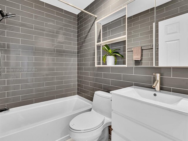 3144 NE 212th St, Aventura, FL 33180 - full bathroom with tile walls, washtub / shower combination, tasteful backsplash, and vanity