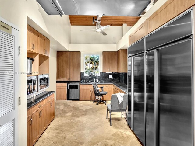 3144 NE 212th St, Aventura, FL 33180 - kitchen featuring appliances with stainless steel finishes, ceiling fan, dark countertops, and tasteful backsplash