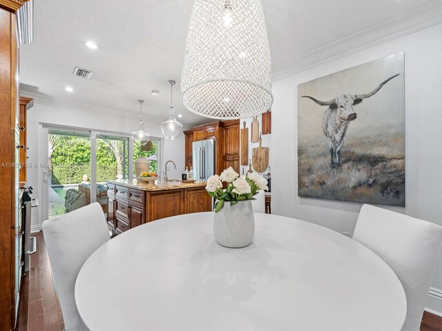 7945 SW 98th Ter, Miami, FL 33156 - dining area featuring ornamental molding and recessed lighting