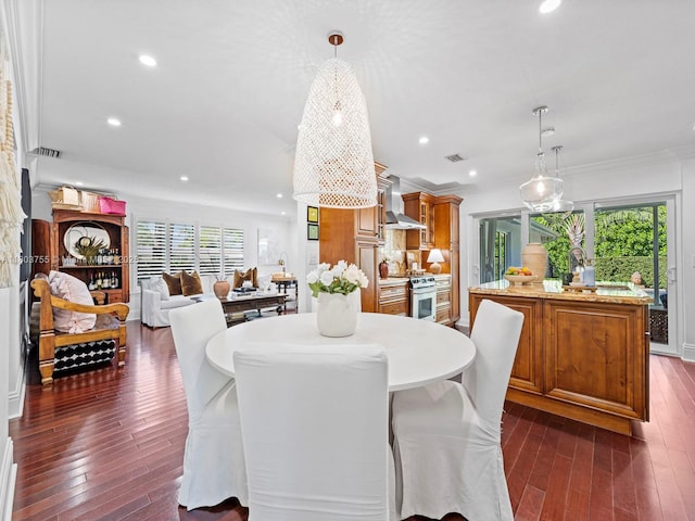7945 SW 98th Ter, Miami, FL 33156 - dining space featuring dark wood finished floors, healthy amount of natural light, recessed lighting, and crown molding