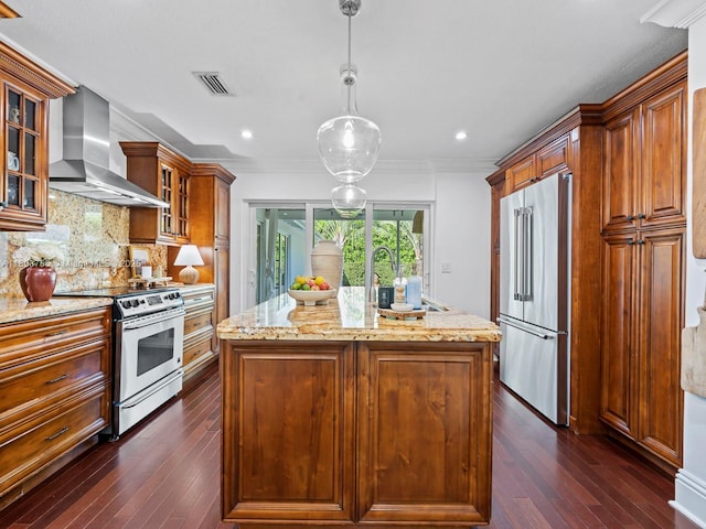 7945 SW 98th Ter, Miami, FL 33156 - kitchen with appliances with stainless steel finishes, wall chimney range hood, dark wood finished floors, light stone counters, and recessed lighting